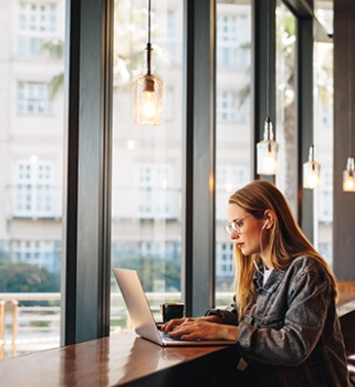 a women typing on her laptop